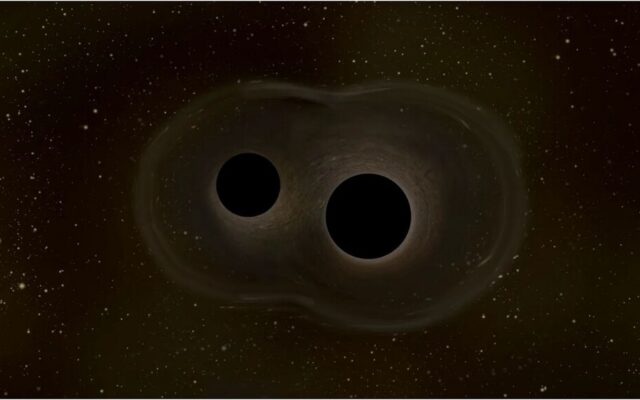La fusión de agujeros negros que rompió todas las reglas tenía truco: una lente gravitacional pudo haber inflado su tamaño